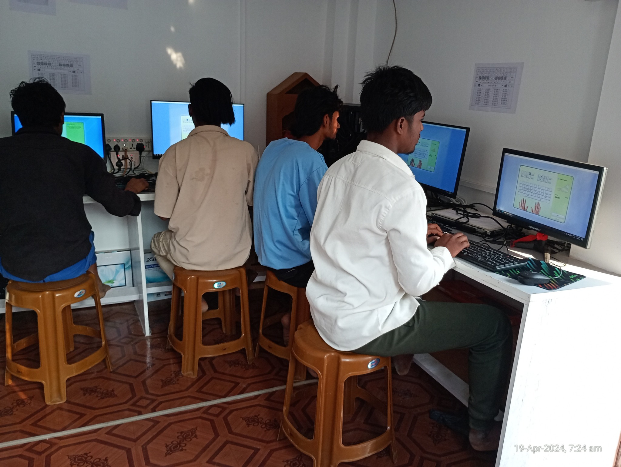 Students learning computers in a lab